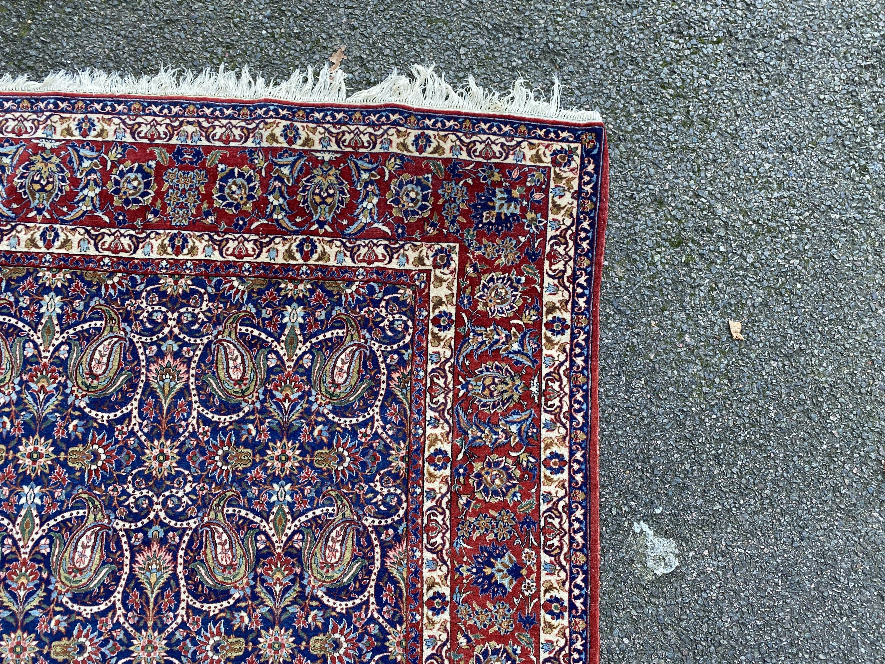 A Tabriz blue ground rug, first half 20th century, 225 cm x 155 cm